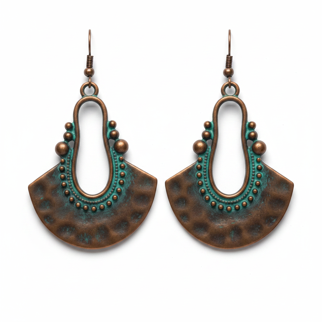 Crescent copper earrings with teal patina arch and beaded detail on white background