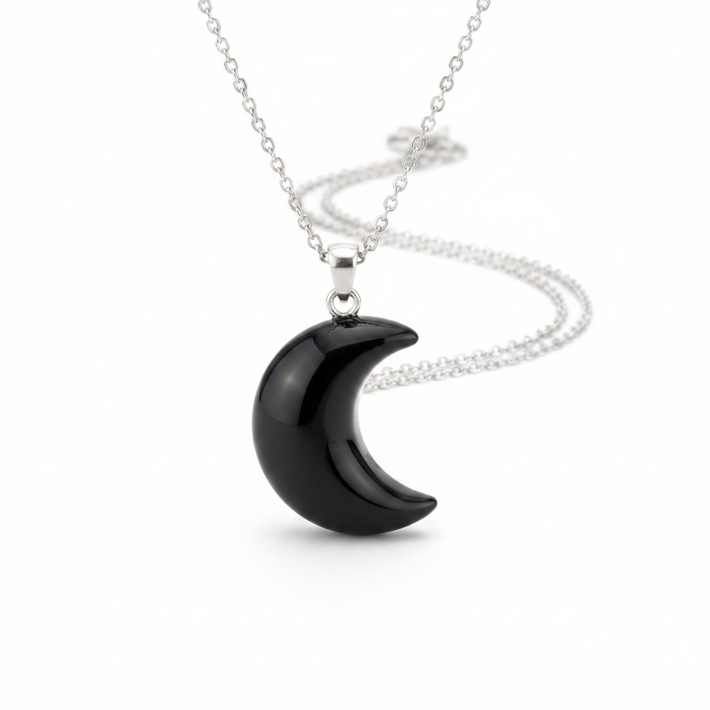 Black crescent moon necklace with glossy black stone pendant on silver chain, white background