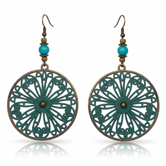Large round teal filigree mandala disc earrings on white background
