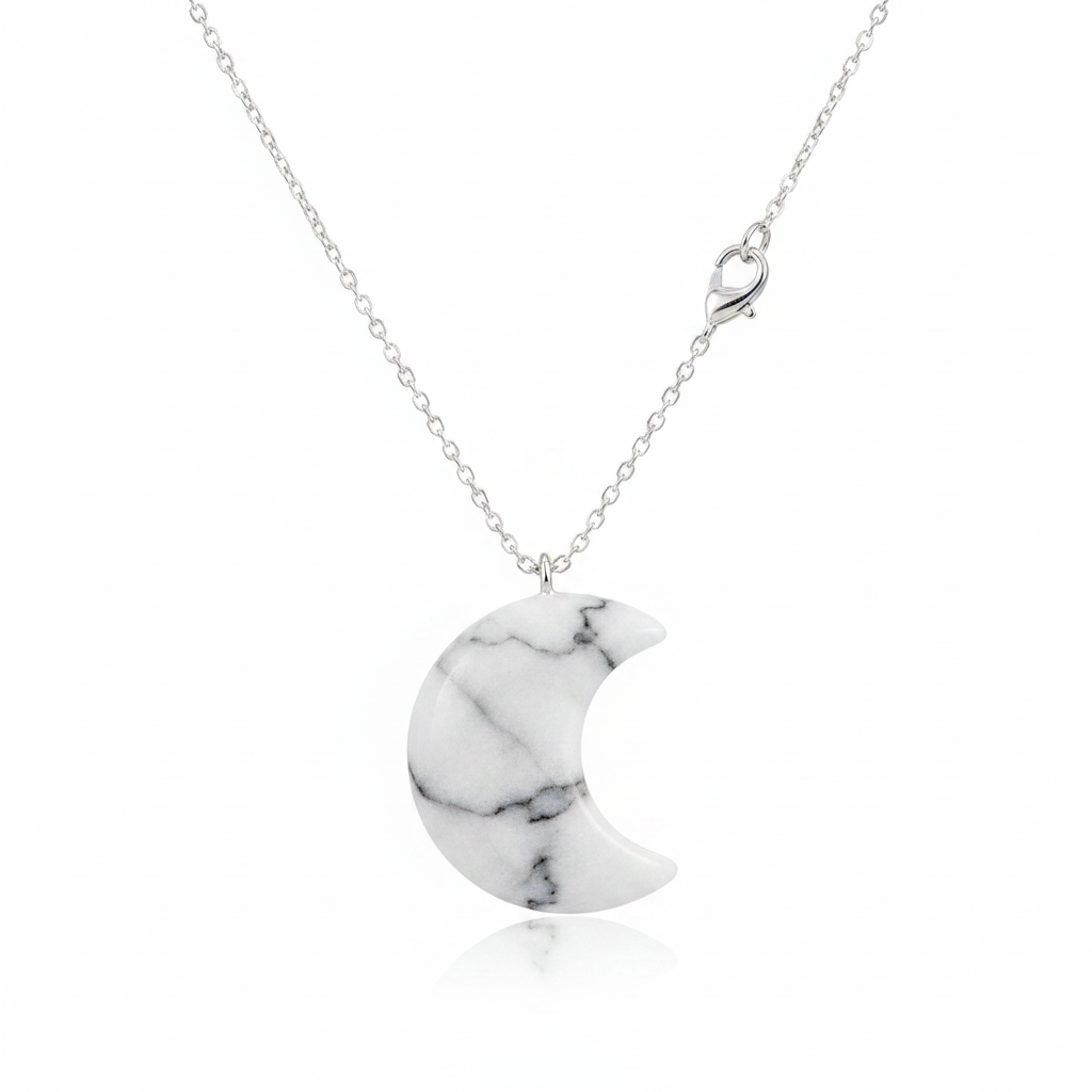 White marble crescent moon necklace with white and grey vein stone pendant on silver chain, white background