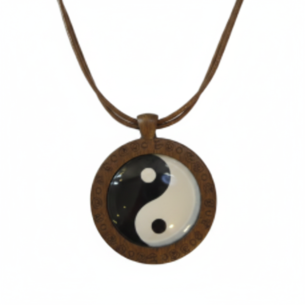 Wooden YinYang pendant necklace on brown cord on white background