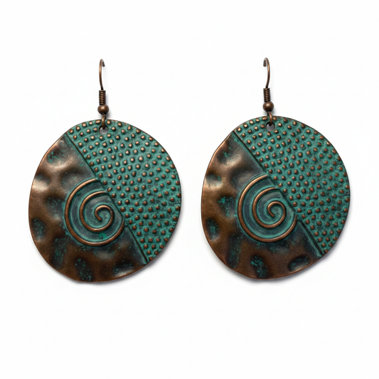 Large round copper disc earrings with teal patina on white background