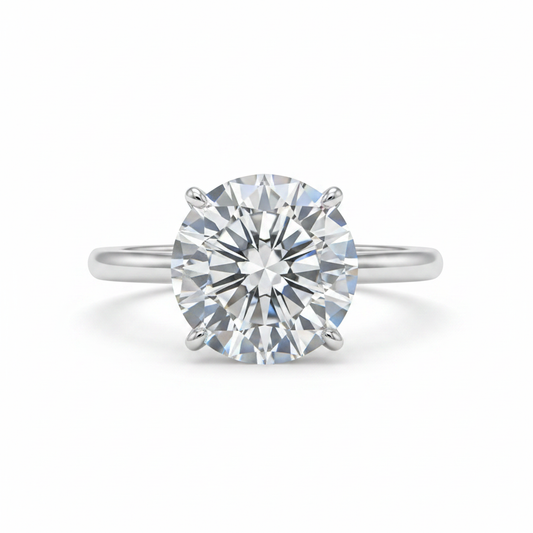 Round brilliant moissanite solitaire ring with crushed ice starburst faceting in six-prong silver setting on white background