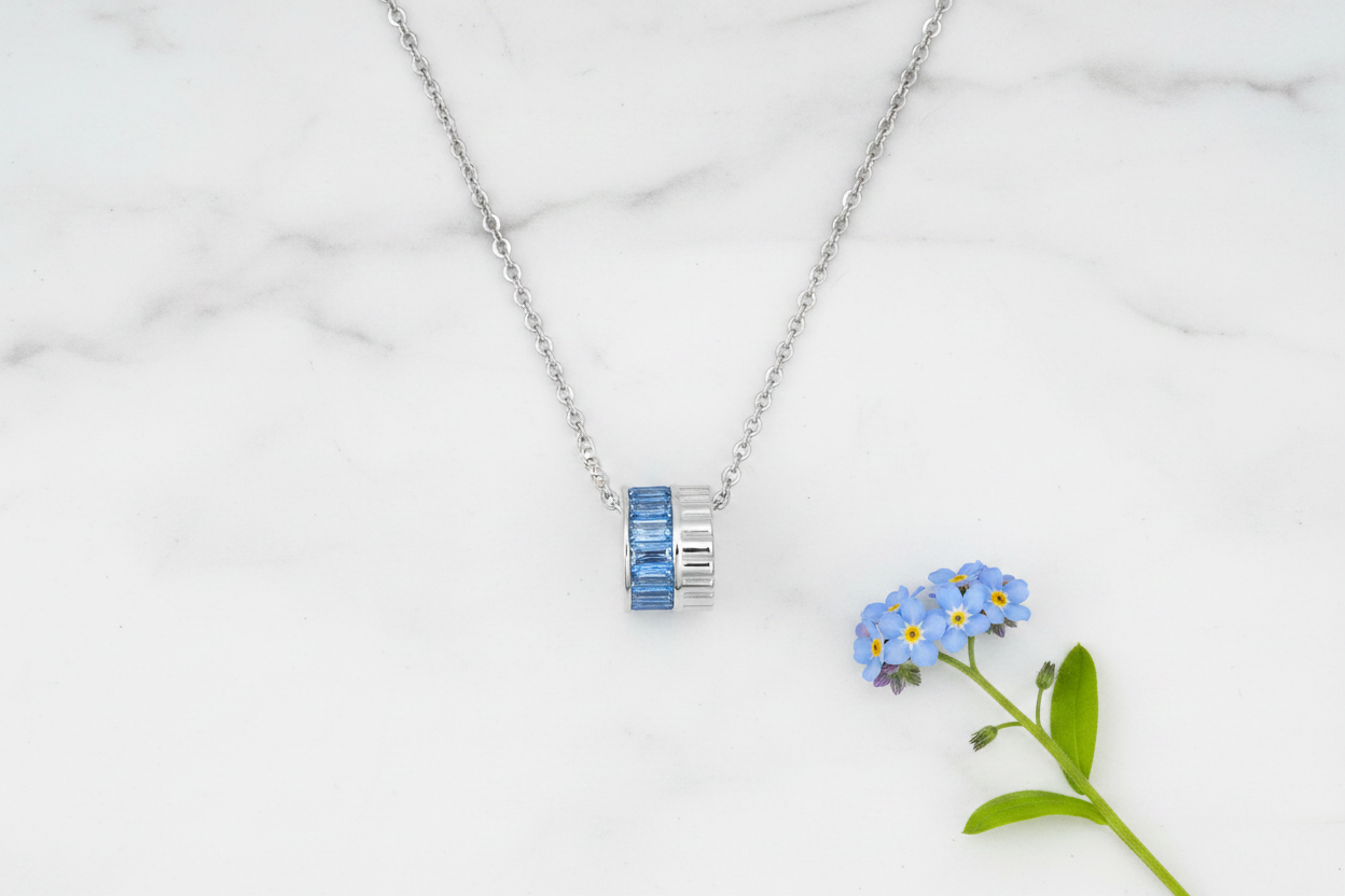 Blue and Silver Necklace - Marble Flat Lay