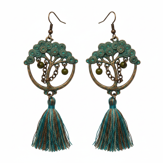 Antique bronze hoop earrings with teal leaf details and tassel drops on white background