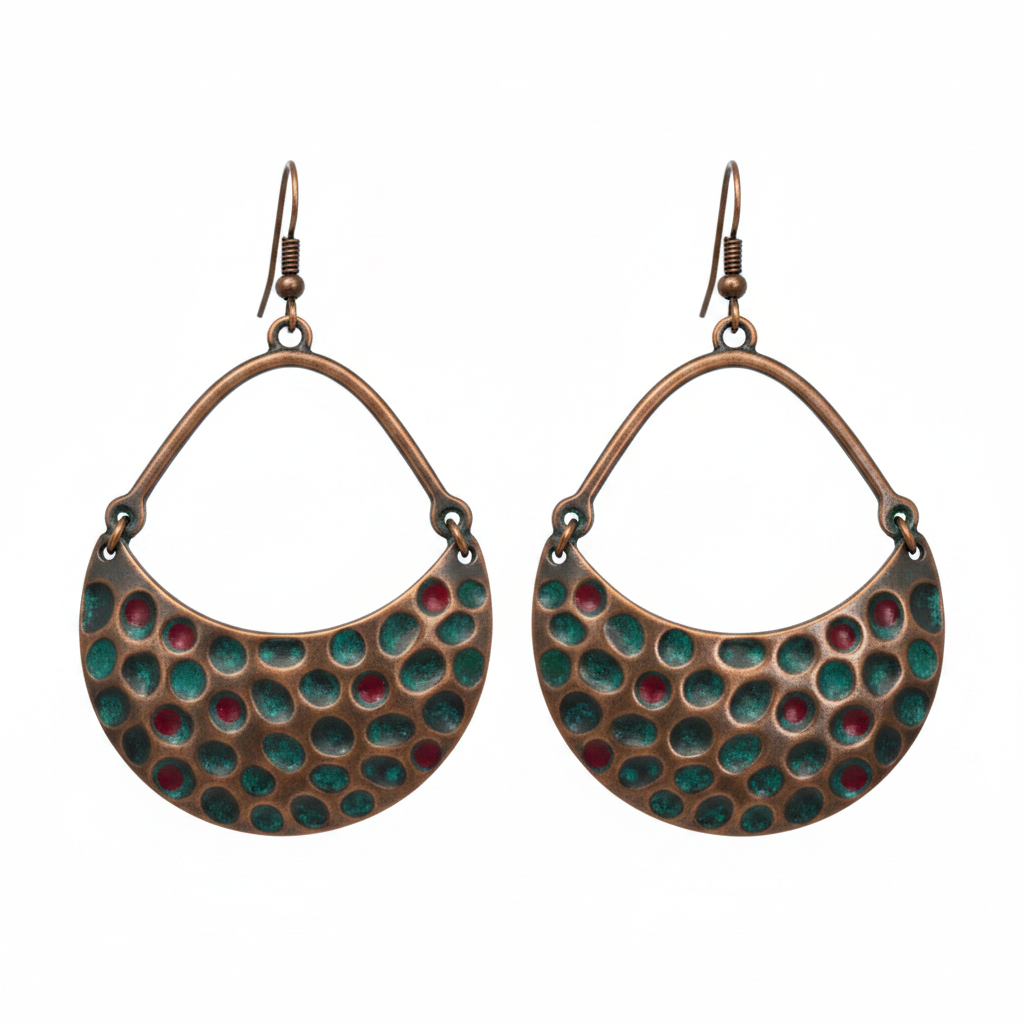 Crescent copper earrings with hammered honeycomb pattern and colourful dot accents on white background
