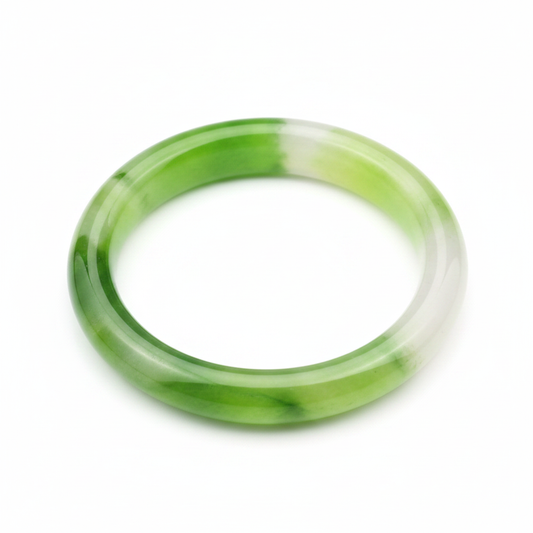 Vibrant translucent jade green bangle bracelet on white background